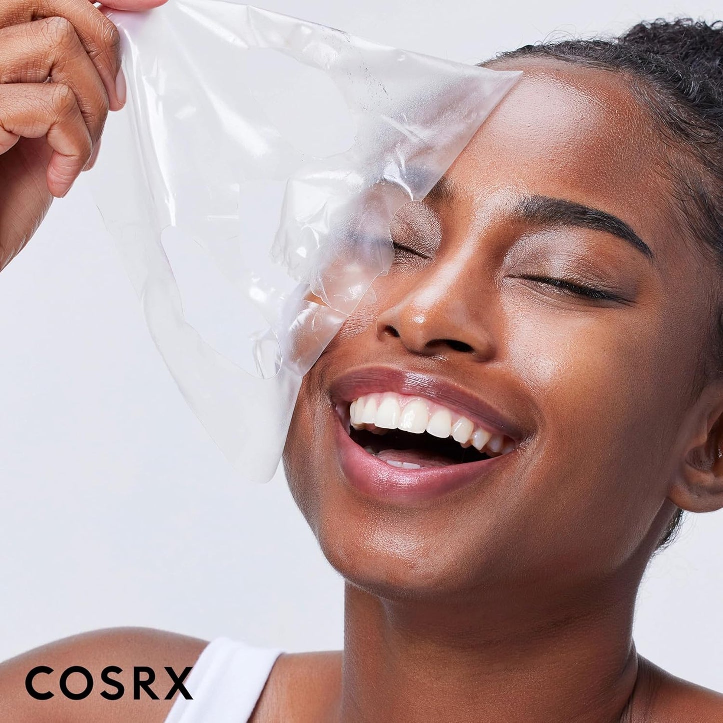 Model removing COSRX hydrogel mask after intensive hydration treatment for glowing healthy-looking skin