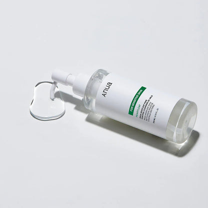 Anua Heartleaf Pore Control Cleansing Oil Mild with oil texture splash and minimalist Korean skincare aesthetic