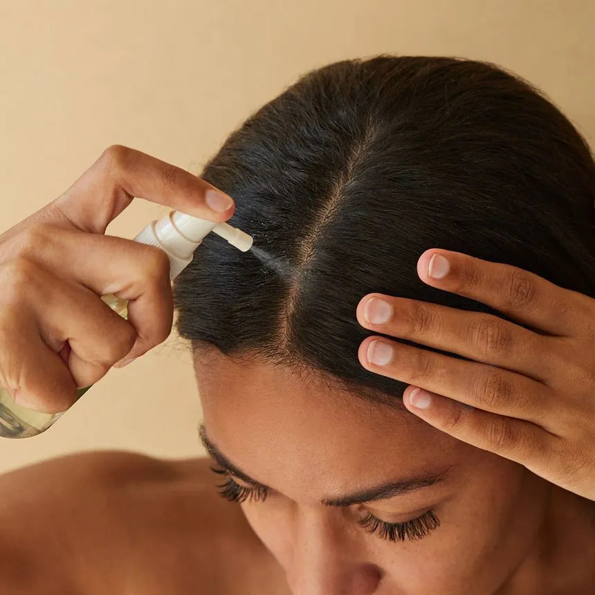 AROMATICA Rosemary Root Enhancer used on hairline demonstrating precise spray application