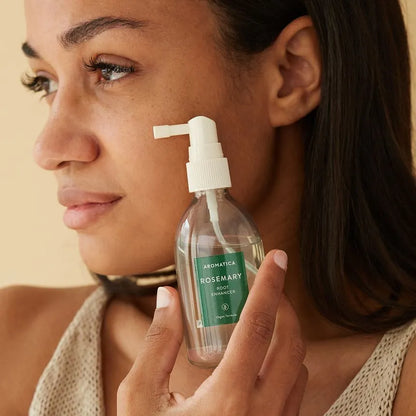 AROMATICA Rosemary Root Enhancer applied on scalp for targeted root care and nourishment