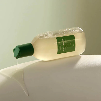 AROMATICA Rosemary Scalp Scaling Shampoo on neutral background highlighting herbal formula