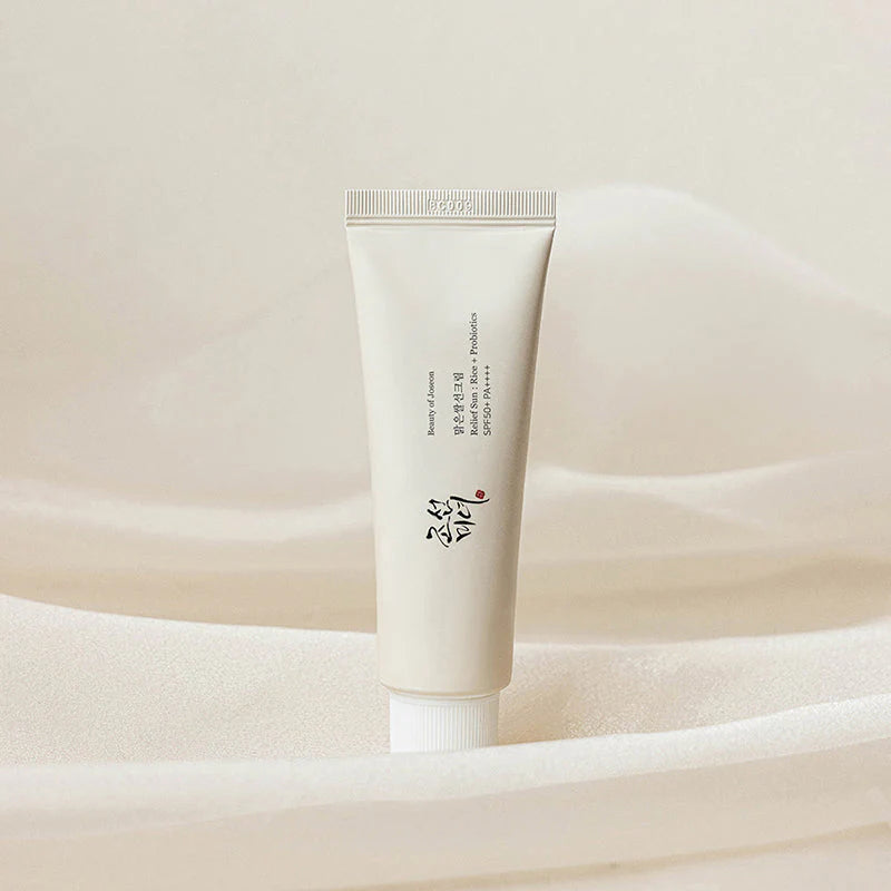 Lightweight Korean sunscreen packaging with soft neutral styling