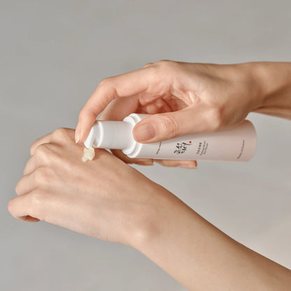 Applying Beauty of Joseon Ginseng Sun Serum SPF50+ with lightweight serum texture