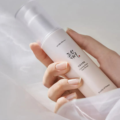 Hand holding Beauty of Joseon Ginseng Moist Sun Serum for lightweight sun protection