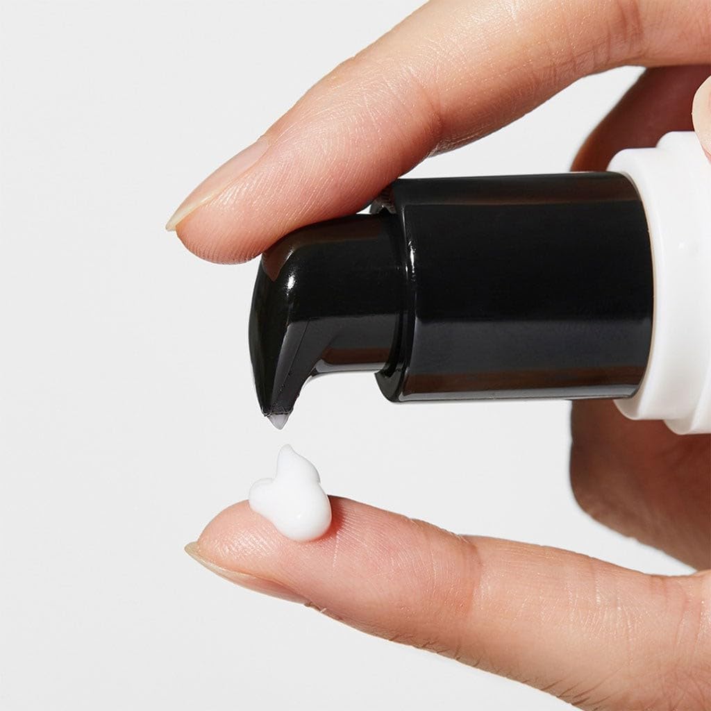 Applying COSRX Snail Peptide Eye Cream for hydrated under eyes and smoother fine lines around the eye area