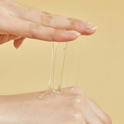 Snail mucin essence texture demonstrating hydrating and elastic Korean skincare formula for dry and damaged skin
