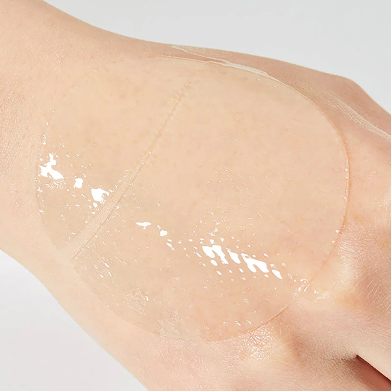 COSRX snail hydrogel eye patch applied on skin showing cooling transparent texture