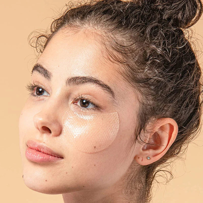 Model wearing COSRX Advanced Snail Hydrogel Eye Patch for dark circles and puffiness care