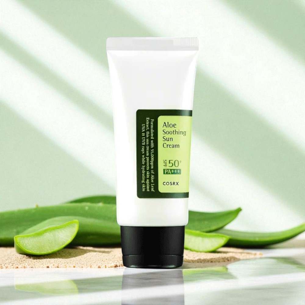 COSRX Aloe Soothing Sun Cream SPF50+ PA+++ with fresh aloe vera background and lightweight moisturizing sunscreen texture