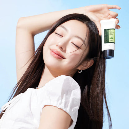 Model holding COSRX Aloe Soothing Sun Cream SPF50+ PA+++ demonstrating radiant protected skin and daily Korean sunscreen use