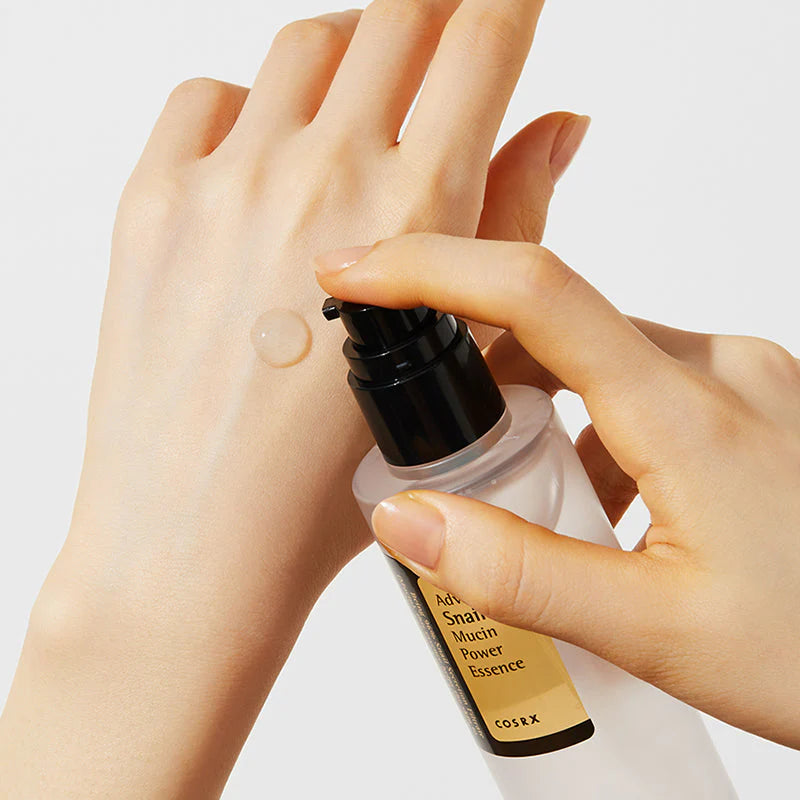 Applying COSRX Advanced Snail 96 Mucin Power Essence to the skin for hydration, skin barrier support, and healthy glow