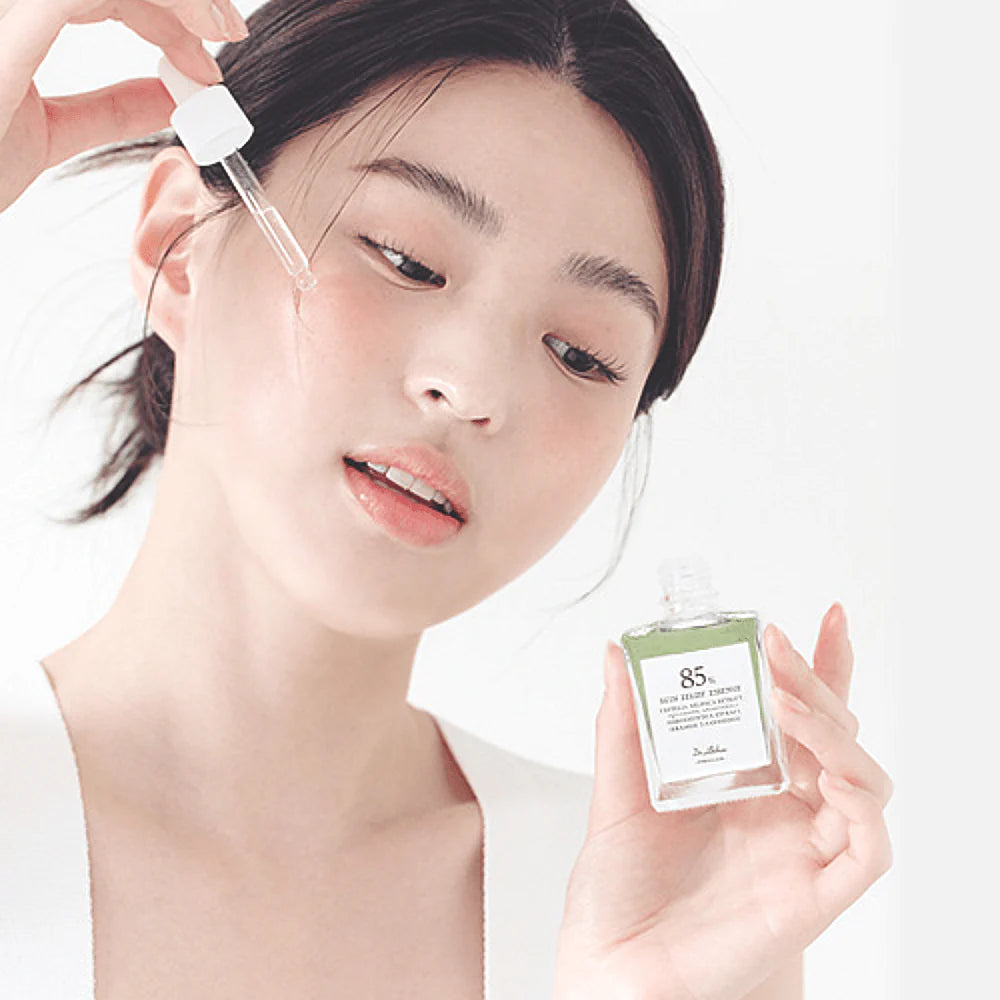 Model applying Dr. Althea Skin Relief Essence for calm hydrated skin and healthy glowing complexion
