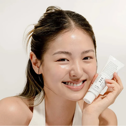 Model holding Dr. Althea 345 Relief Cream Korean barrier repair moisturizer for glowing healthy skin in KSA