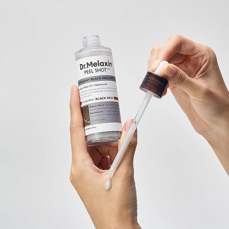 Dr. Melaxin ampoule applied with dropper showing lightweight exfoliating texture
