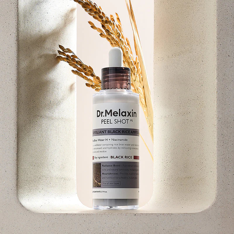 Dr. Melaxin Peel Shot ampoule in minimal setting highlighting lightweight exfoliating formula