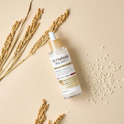 Dr. Melaxin White Rice ampoule with rice grains highlighting brightening and exfoliating ingredients