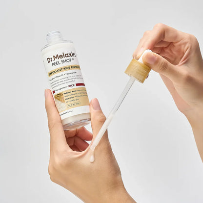 Dr. Melaxin White Rice ampoule applied with dropper showing lightweight exfoliating texture