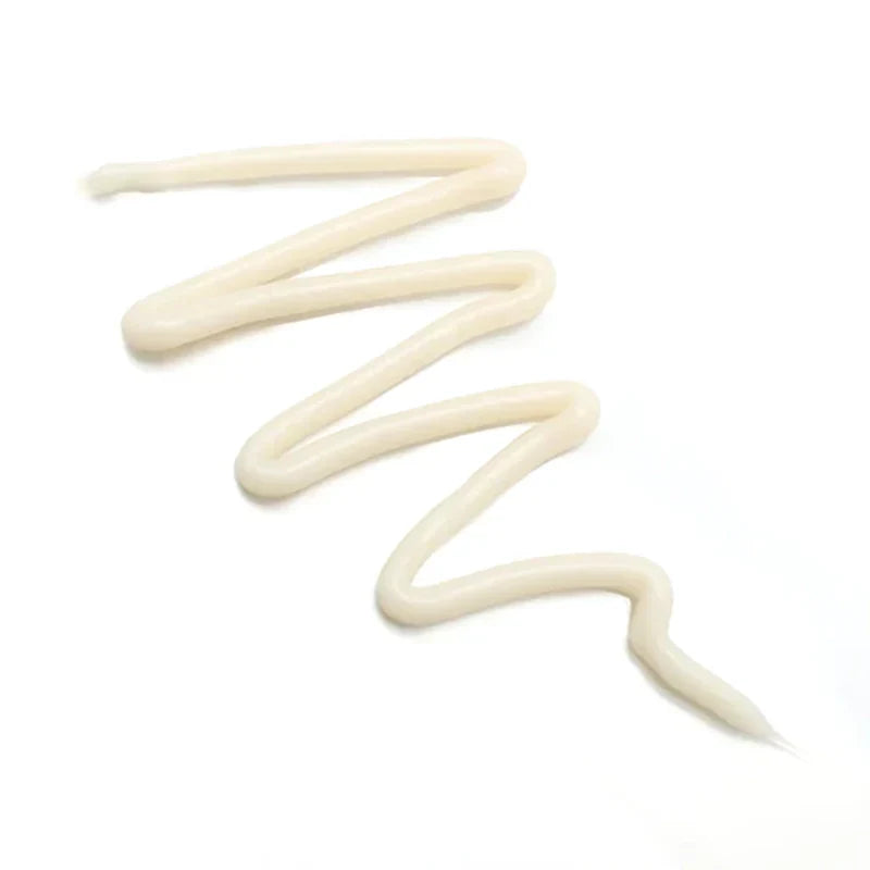Close-up of CER-100 protein treatment texture showing rich creamy hair mask formula