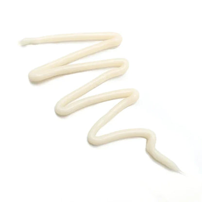 Close-up of CER-100 protein treatment texture showing rich creamy hair mask formula