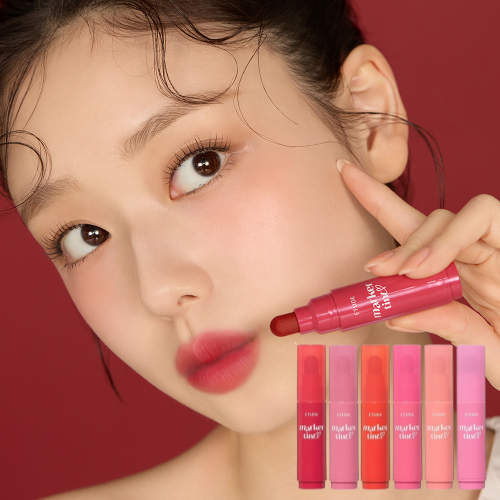 Woman holding Etude lip tint for natural makeup look
