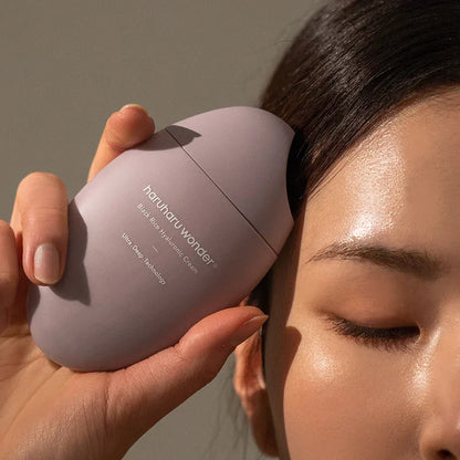Applying Haruharu Wonder Black Rice 10 Hyaluronic Cream to face - deeply hydrating Korean moisturizer for all skin types