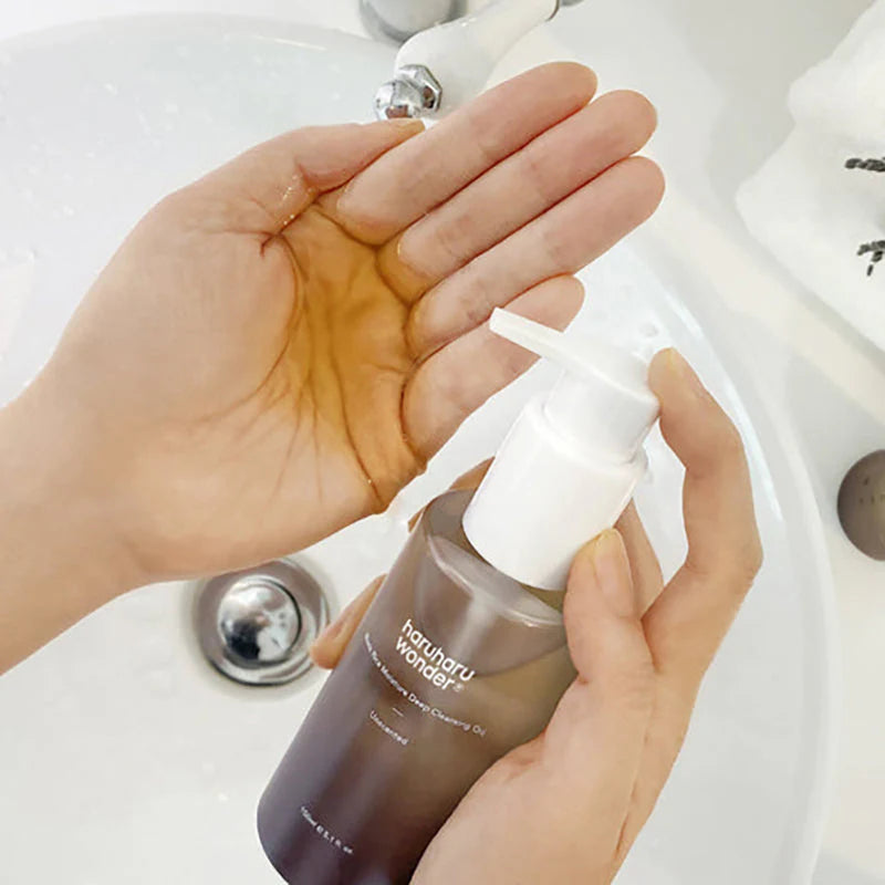 Applying Haruharu Wonder Black Rice Deep Cleansing Oil - first step double cleansing routine Korean skincare