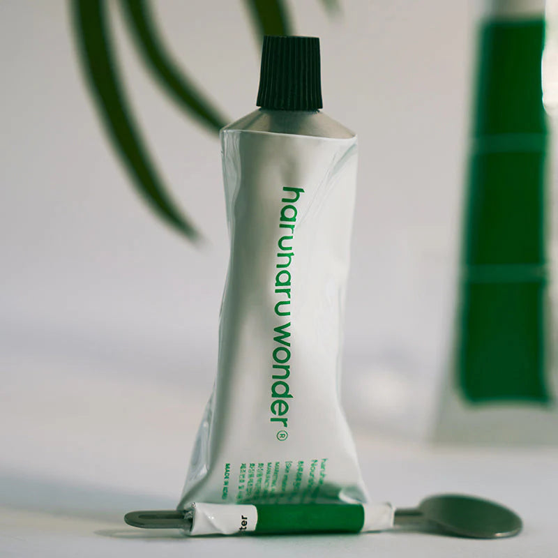 Haruharu Wonder Black Bamboo Hand Cream open tube showing cream texture - fast absorbing Korean hand cream