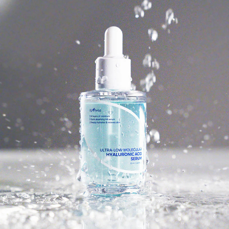 Isntree Ultra-Low Molecular Hyaluronic Acid Serum with water splash effect showing intense moisture absorption