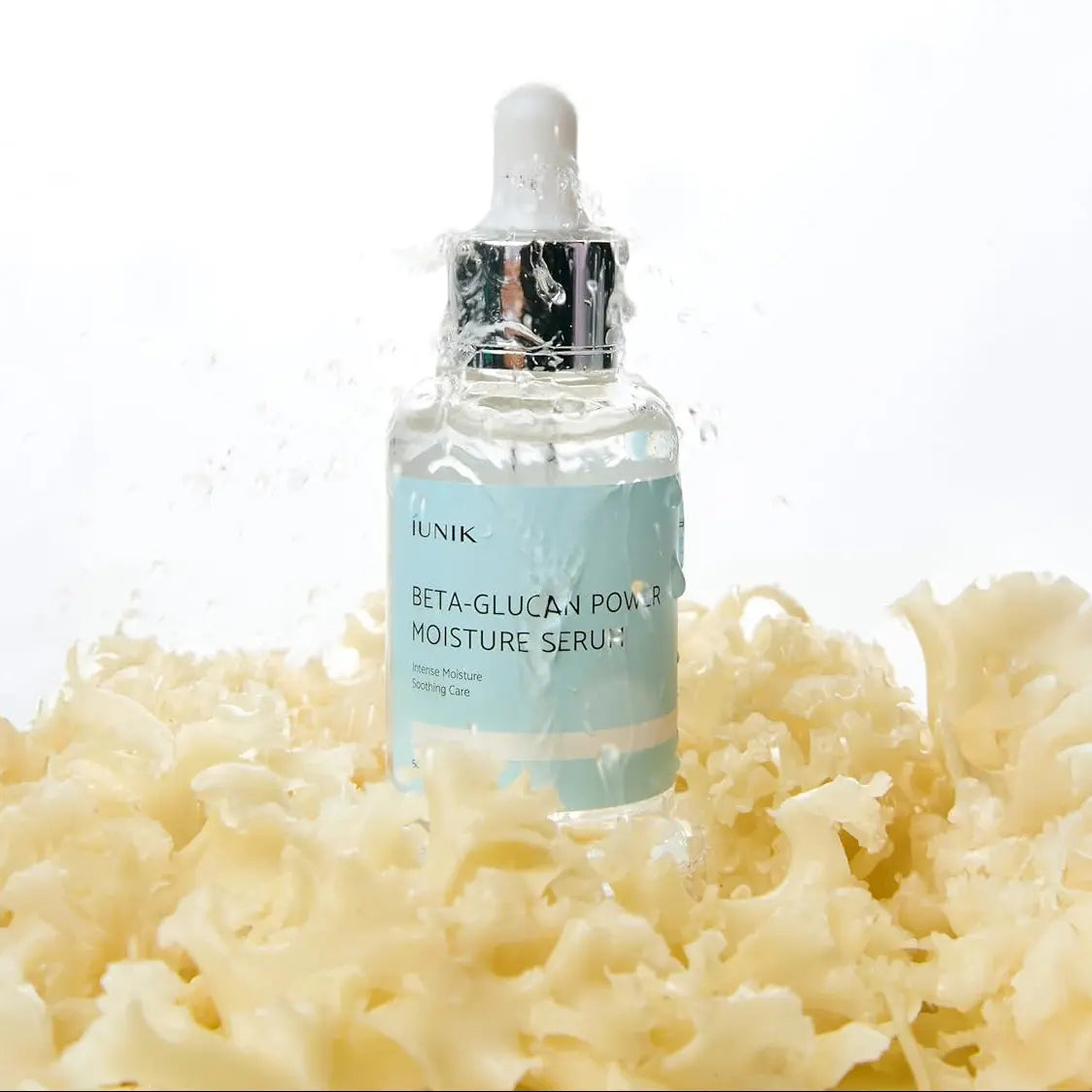 iUNIK Beta-Glucan Power Moisture Serum with textured background showcasing hydrating properties