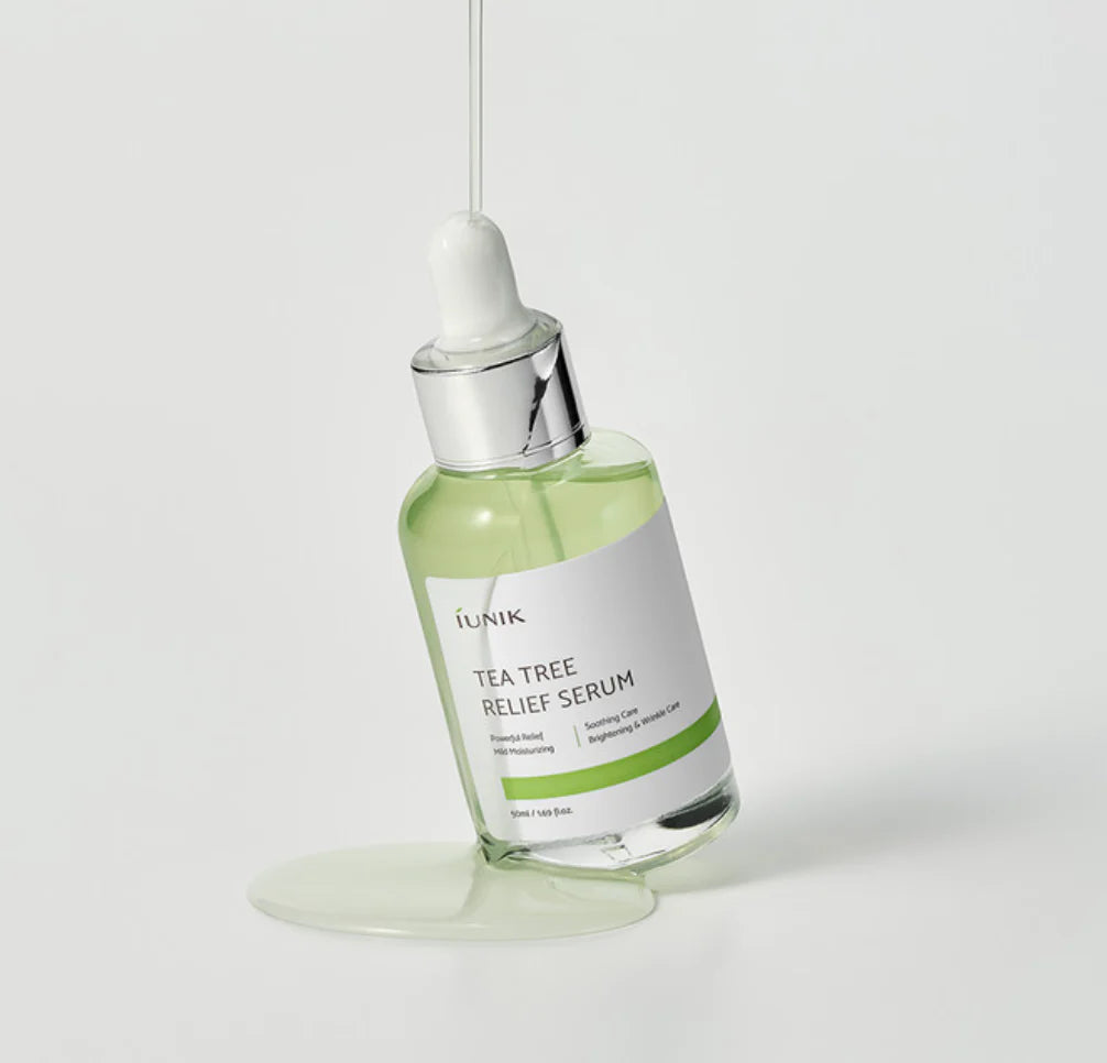 Glass dropper dispensing iUNIK Tea Tree Relief Serum, Korean skincare in Saudi Arabia