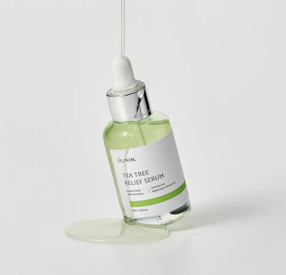 Glass dropper dispensing iUNIK Tea Tree Relief Serum, Korean skincare in Saudi Arabia
