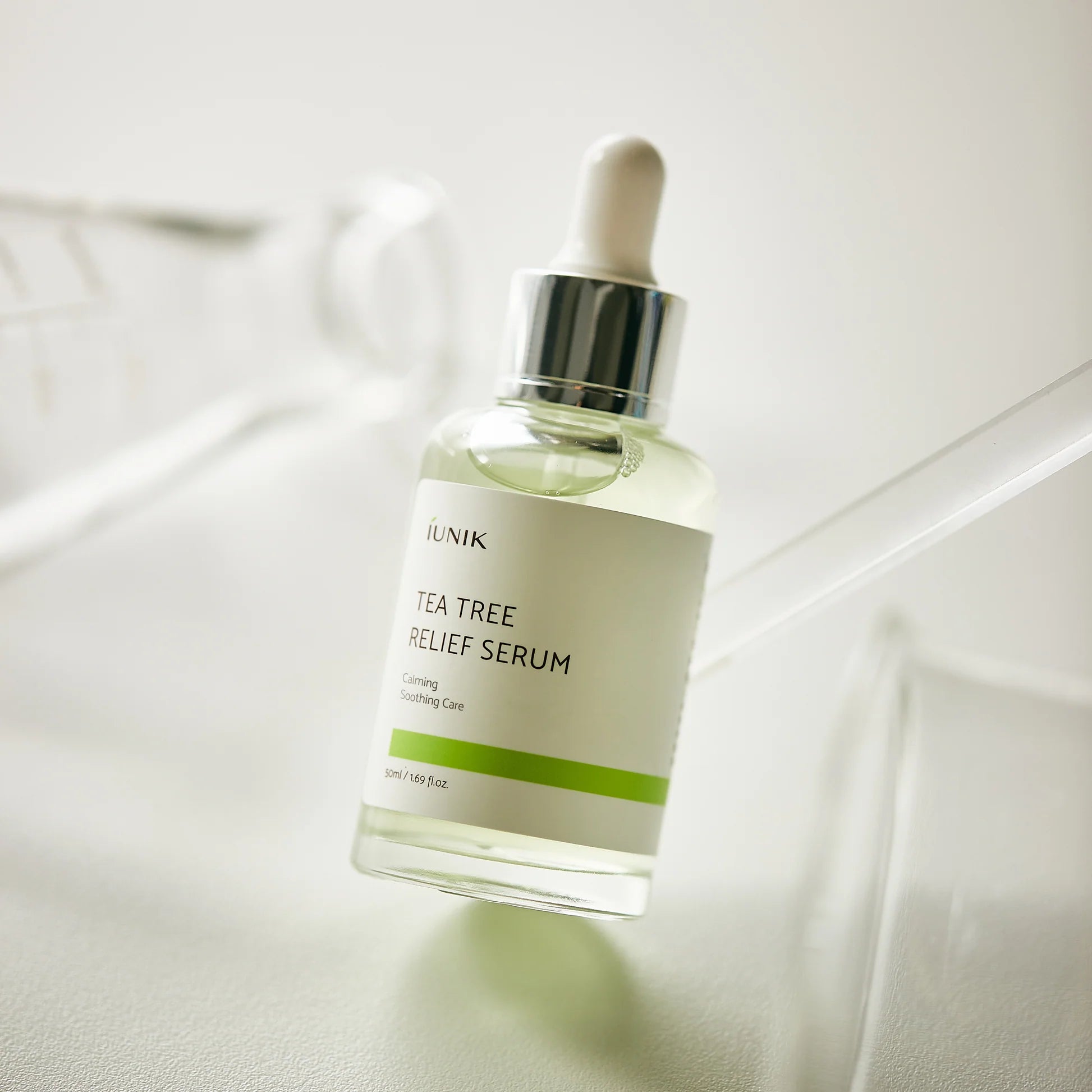 iUNIK Tea Tree Relief Serum bottle on a soft neutral background, buy Korean serum in Jeddah