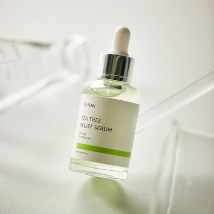 iUNIK Tea Tree Relief Serum bottle on a soft neutral background, buy Korean serum in Jeddah