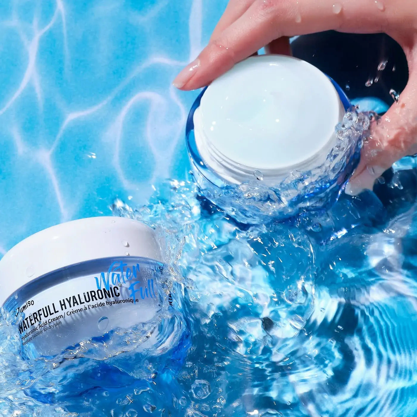 Jumiso Waterfull Hyaluronic Cream jar in water splash emphasizing refreshing hydration effect