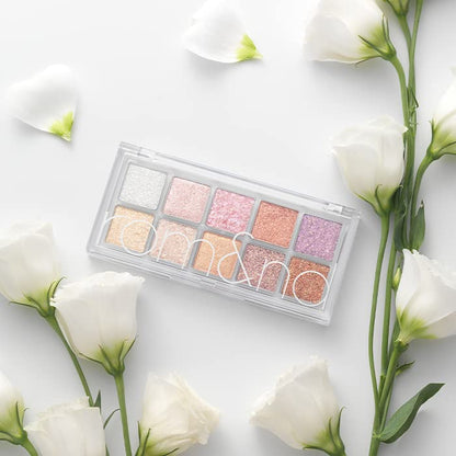 rom&nd Better Than Palette 01 Light & Glitter Garden displayed in floral setting with soft aesthetic styling