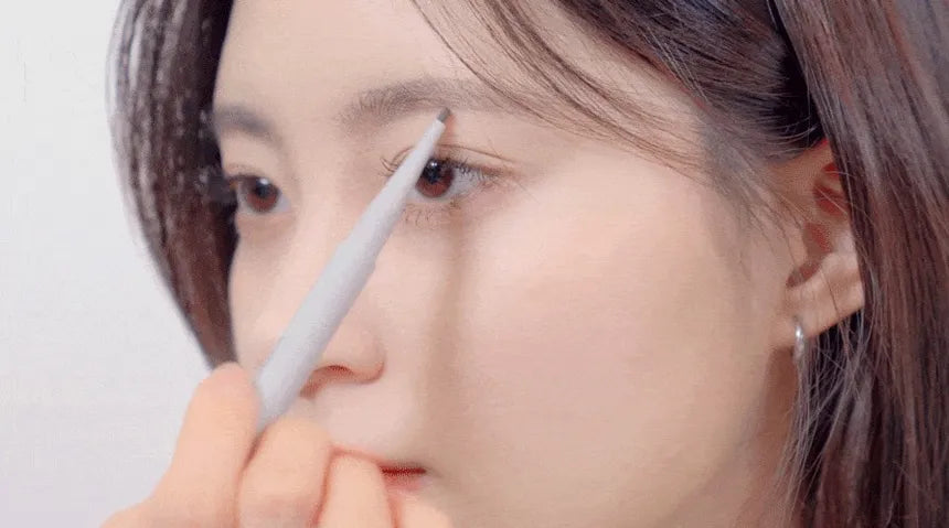 Model using rom&nd Han All Flat Brow pencil demonstrating precise brow shaping