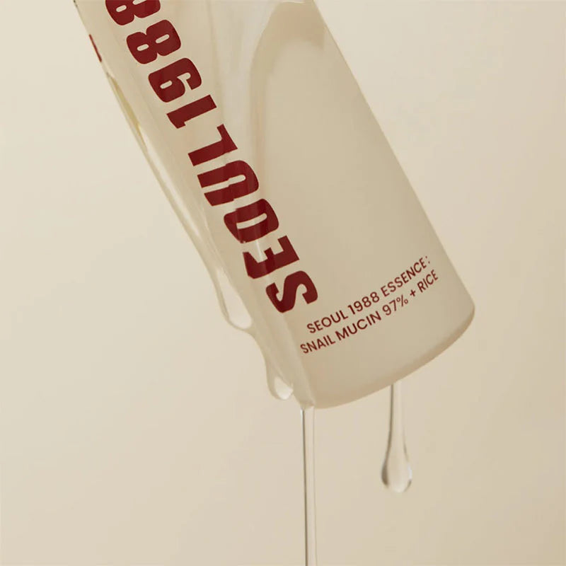 K-Secret Seoul 1988 Snail Mucin Essence dripping from the pump bottle, Korean hydrating essence in Riyadh