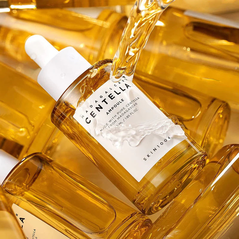 SKIN1004 Madagascar Centella Ampoule bottle with golden liquid texture calming hydrating ampoule close-up