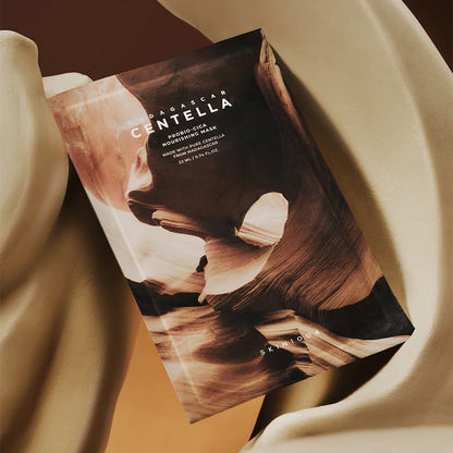 SKIN1004 Madagascar Centella Probio-Cica Nourishing Mask sachet on fabric backdrop rich moisturizing face mask