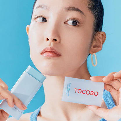 TOCOBO Cotton Soft Sun Stick SPF50+ PA++++ applied on face model using sun stick for matte soft finish UV protection
