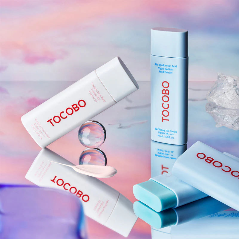 TOCOBO Cotton Soft Sun Stick SPF50+ PA++++ multiple products flat lay colorful background Korean sunscreen lineup