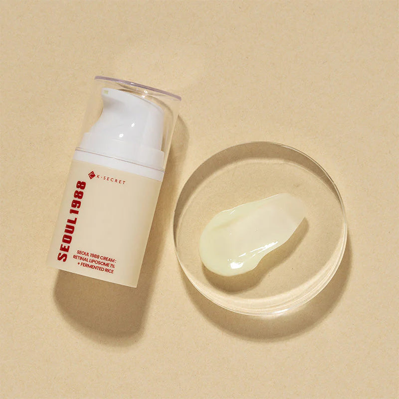 K-Secret Seoul 1988 Retinal Cream bottle lying beside a cream swatch, Korean anti-aging cream in Riyadh