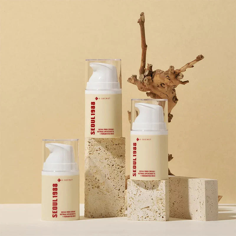 K-Secret Seoul 1988 Korean skincare range displayed with a dried root on stone pedestals